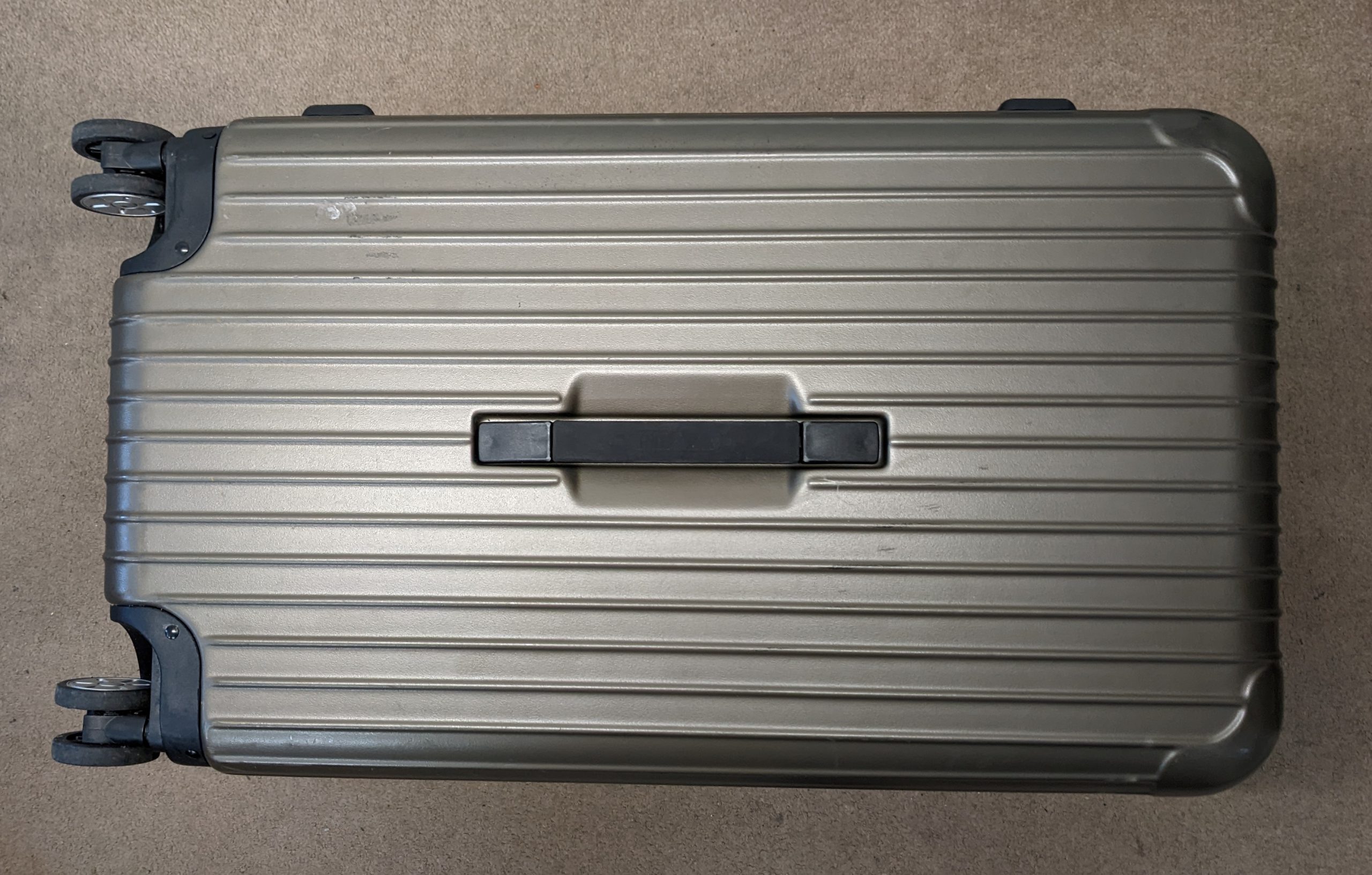 RIMOWA suitcase handle repair – The Shoe Carers